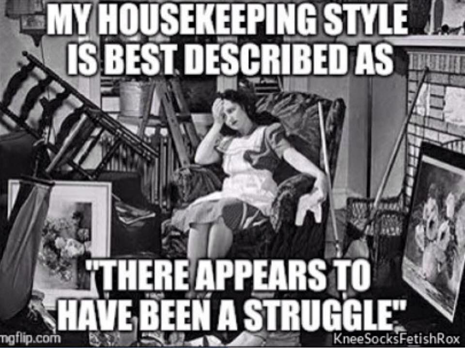 black and white picture of a woman sitting in a wingback chair with her right arm on the chair and her forehead resting on her hand. Around her there is a chaotic room with upended chairs, artwork on the floor, etc. There is a caption that reads 'My housekeeping style is best described as there appears to have been a struggle'